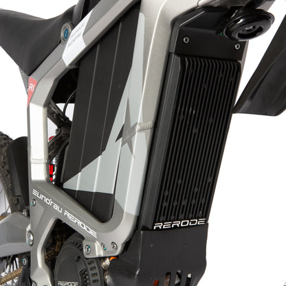 Close-up of a motorcycle radiator with 'RERODE' branding on a white background
