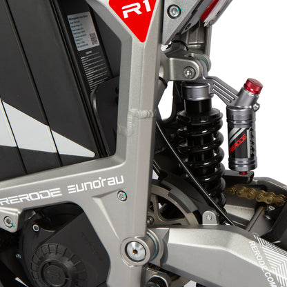 Close-up of a motorcycle suspension system with 'Acerbo' branding.