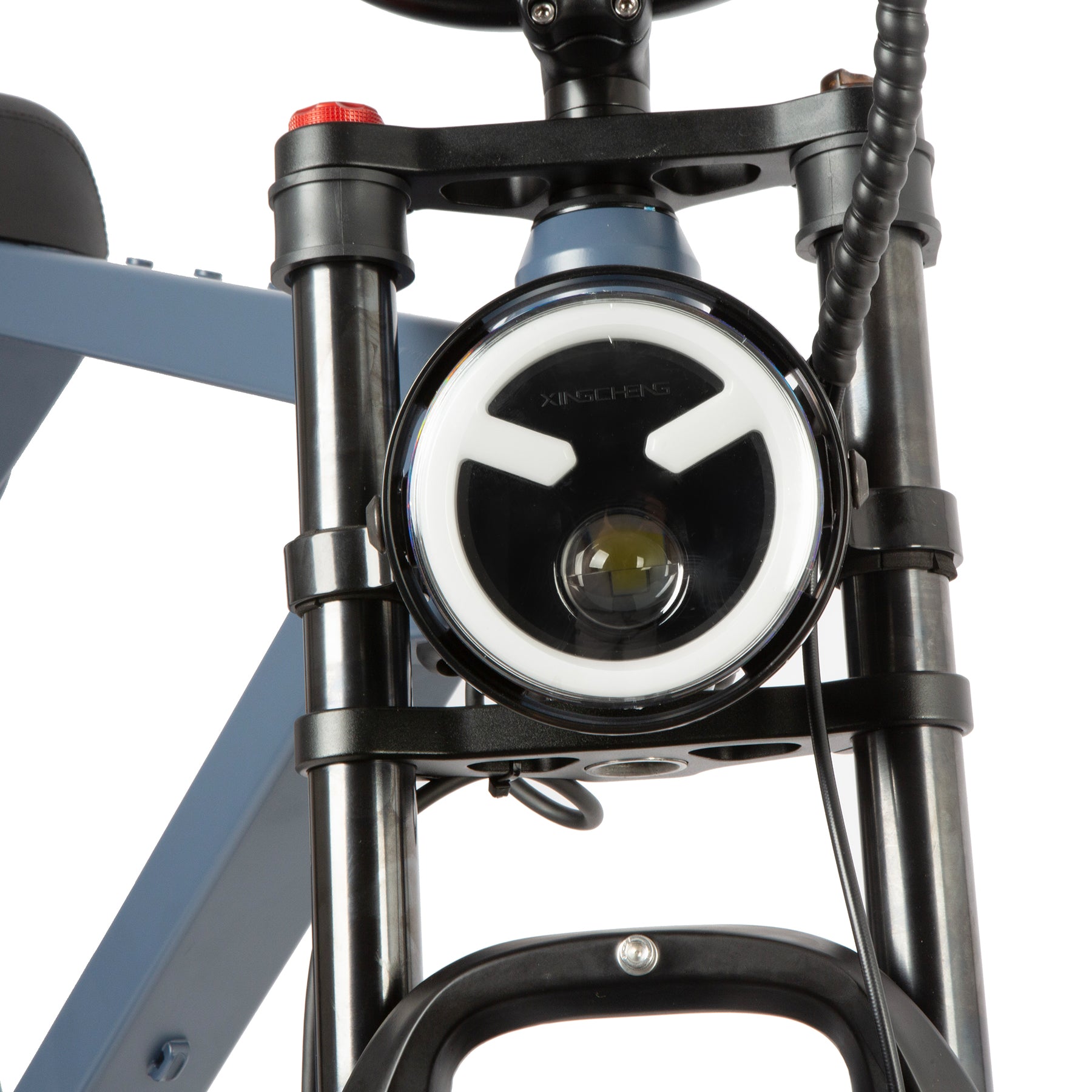 Close-up of a bike headlight on a white background