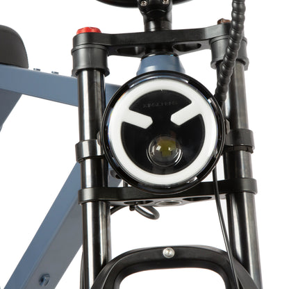 Close-up of a bike headlight on a white background