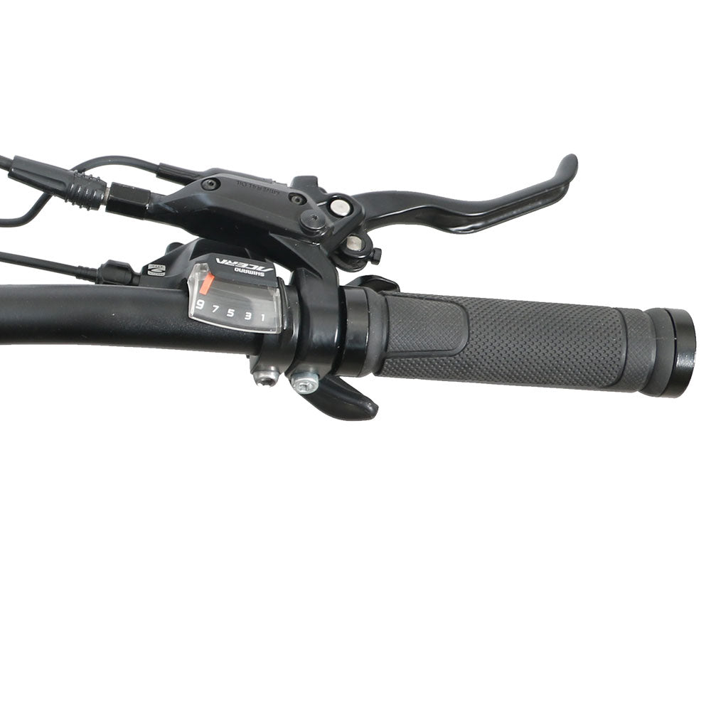 Close-up of a motorcycle handlebar with controls on a white background