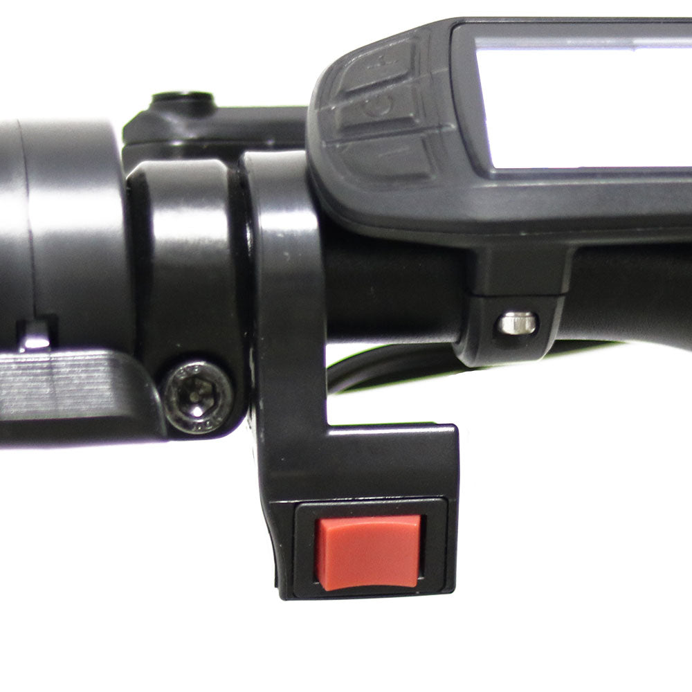 Close-up of a black handheld tool with a red switch on a white background