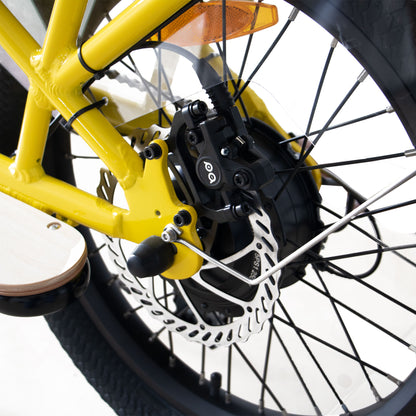 Close-up of a yellow bicycle wheel with disc brake system on a white background