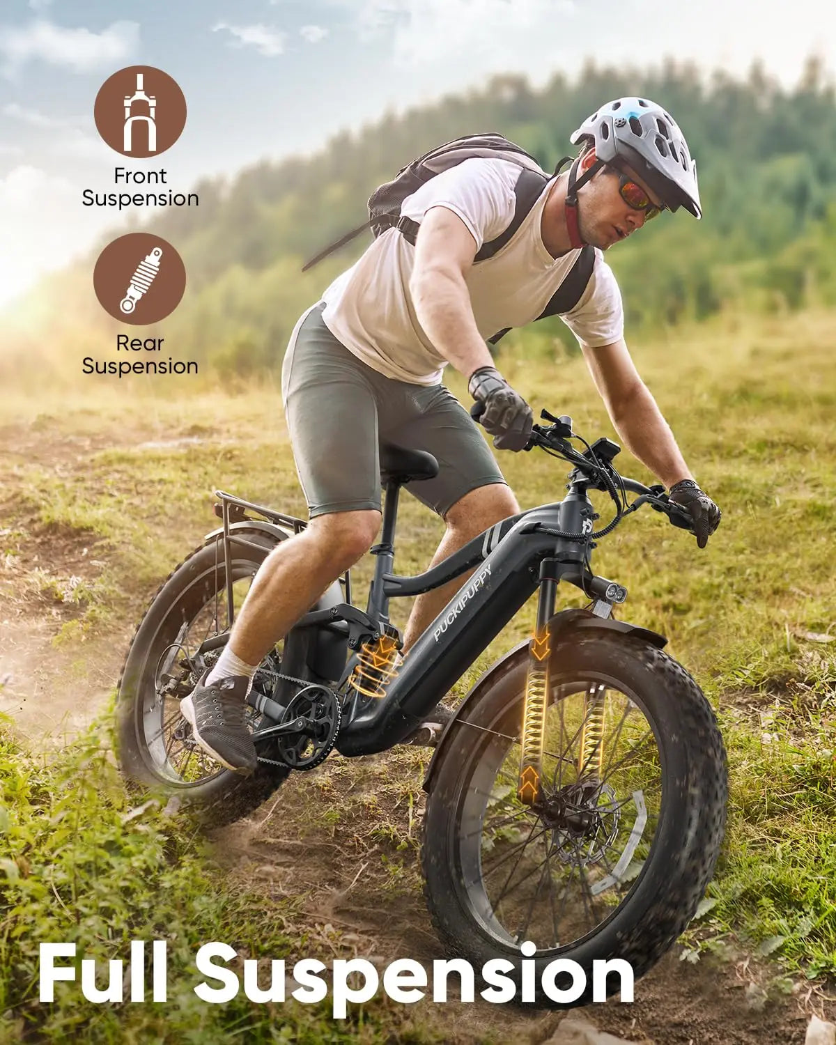 Man riding a full suspension electric bike on a trail with graphics indicating front and rear suspension.