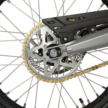 Close-up of a bicycle chain and gear system on a white background