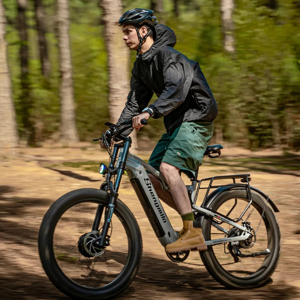 Person riding an electric bike in a forested area