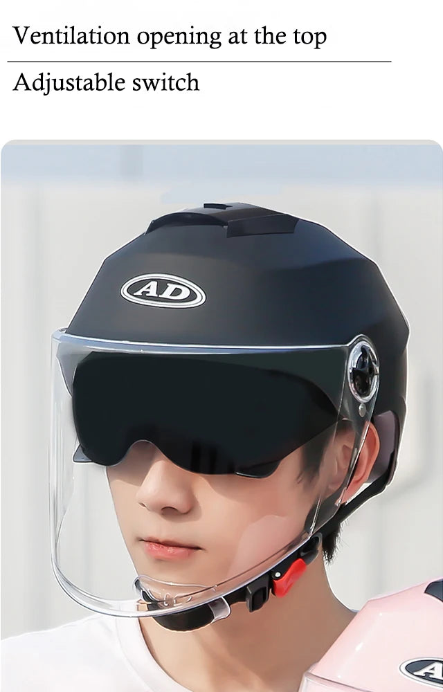 Helmet with clear visor and adjustable switch on a plain background