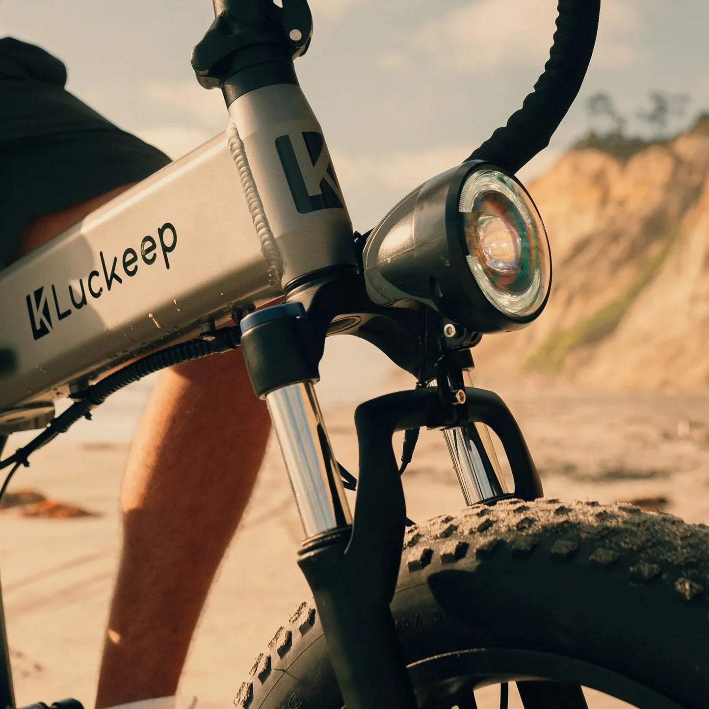 Close-up of a Luckeep electric bike with a scenic background