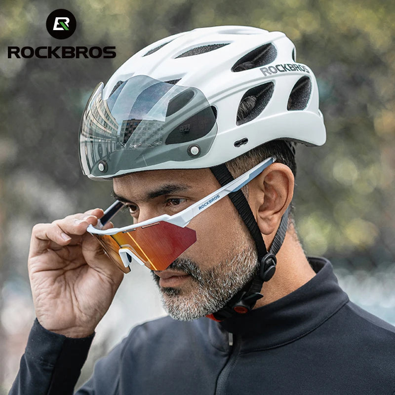 Man wearing a white ROCKBROS helmet with a blurred outdoor background