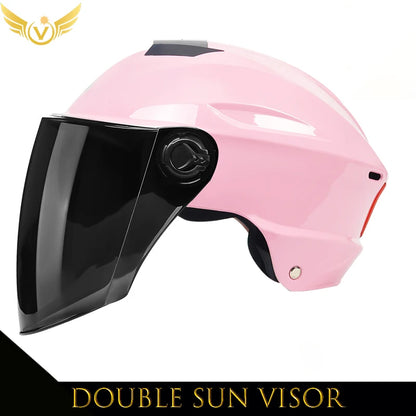Pink helmet with a black visor on a white background