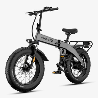 Gray electric bike with black tires on a white background
