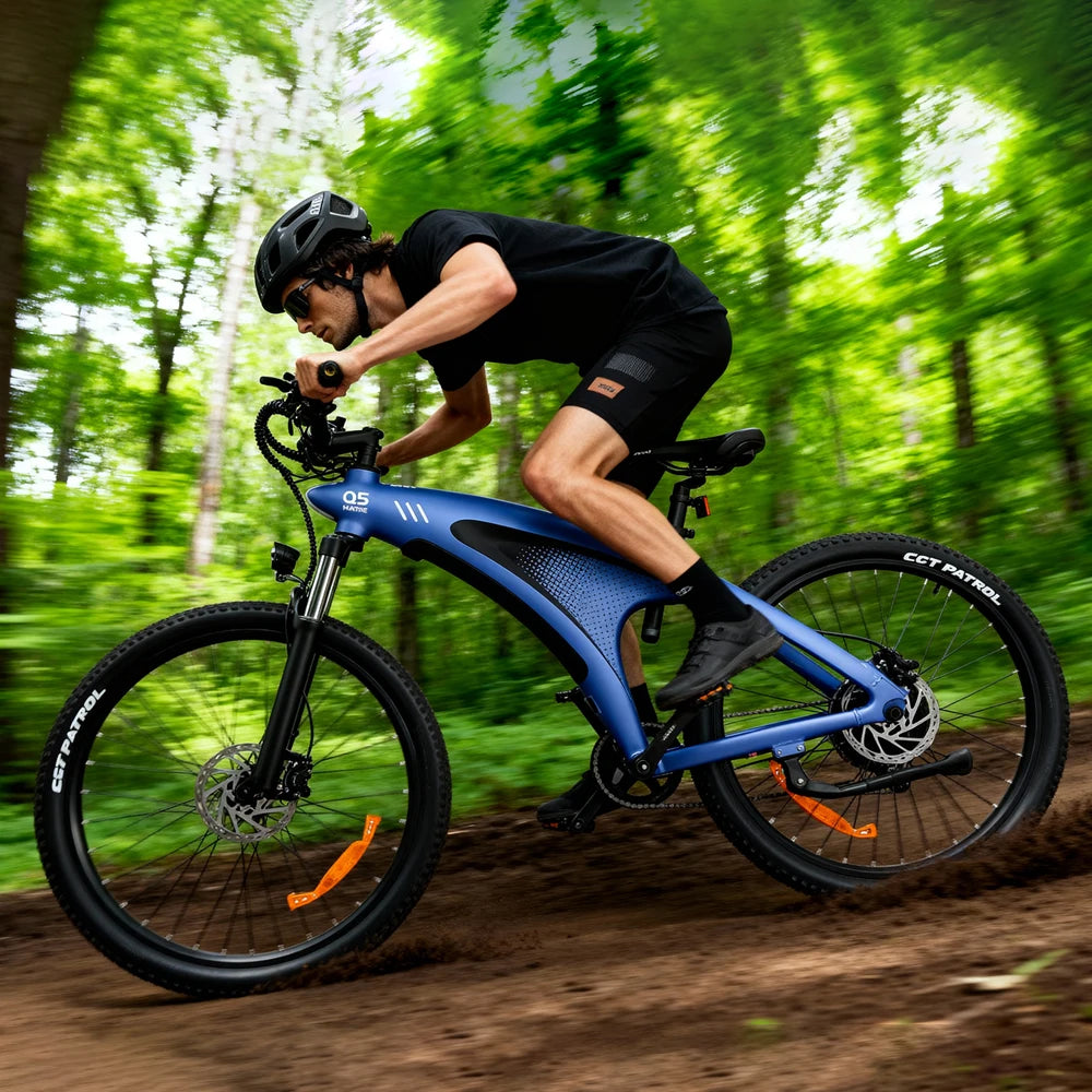 Person riding a blue electric bike on a forest trail