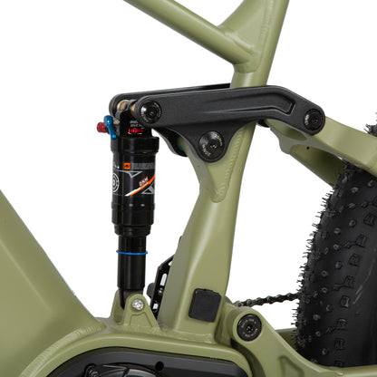 Close-up of a green electric bike with suspension fork on a white background
