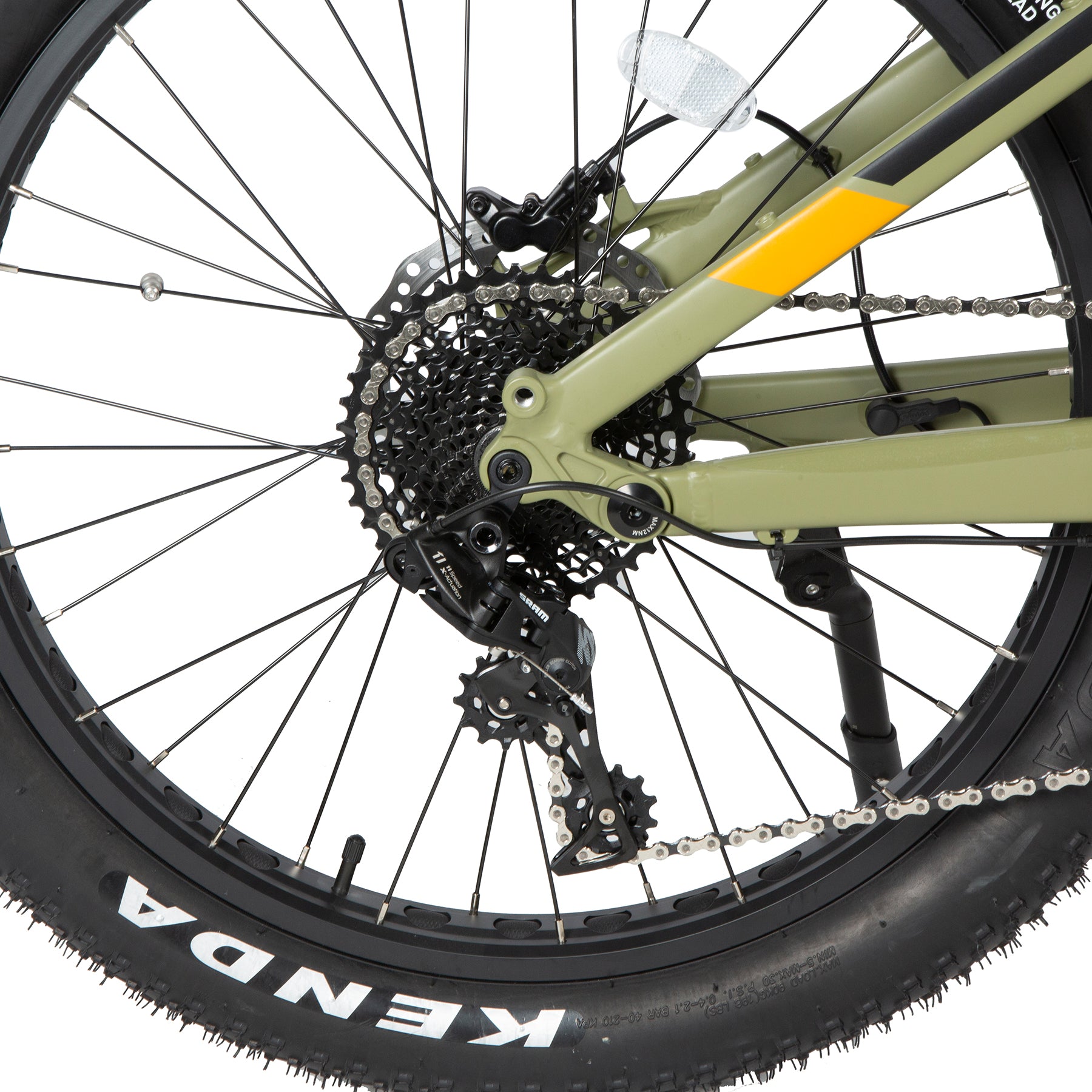 Close-up of a bicycle wheel with gear system and Kenda tire on a white background