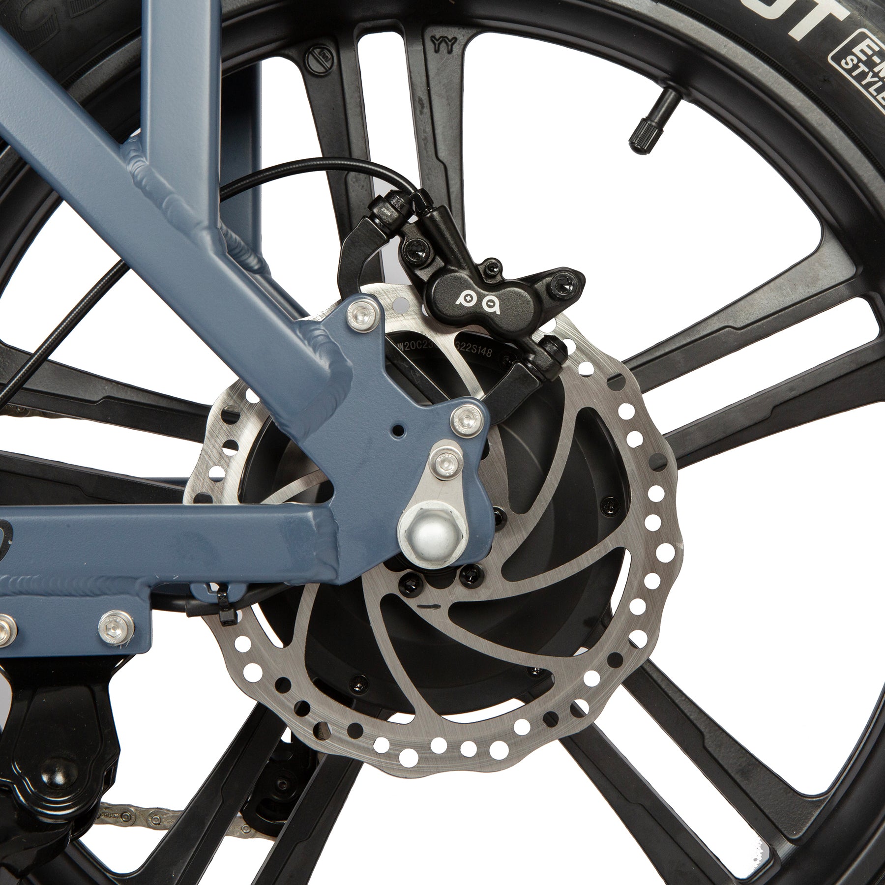 Close-up of a bicycle wheel with disc brake system on a white background