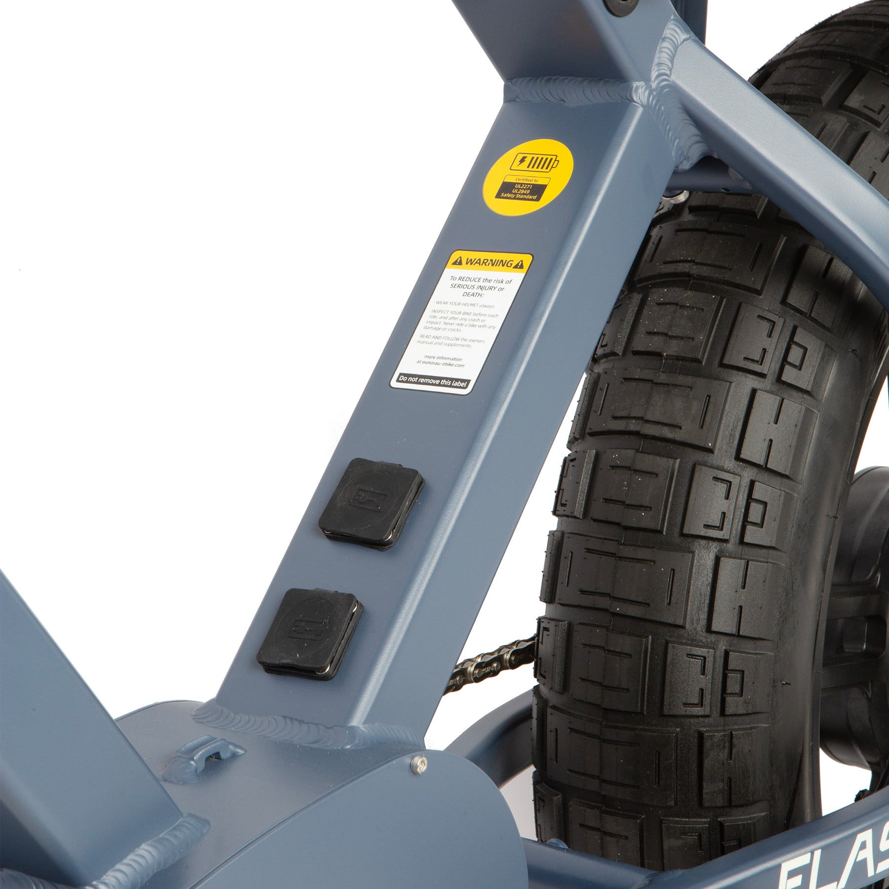 Close-up of a blue bike frame with a tire on a white background