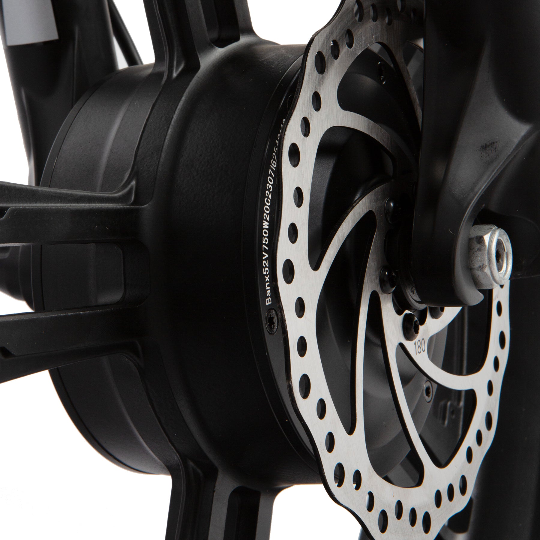 Close-up of a motorcycle disc brake with a white background