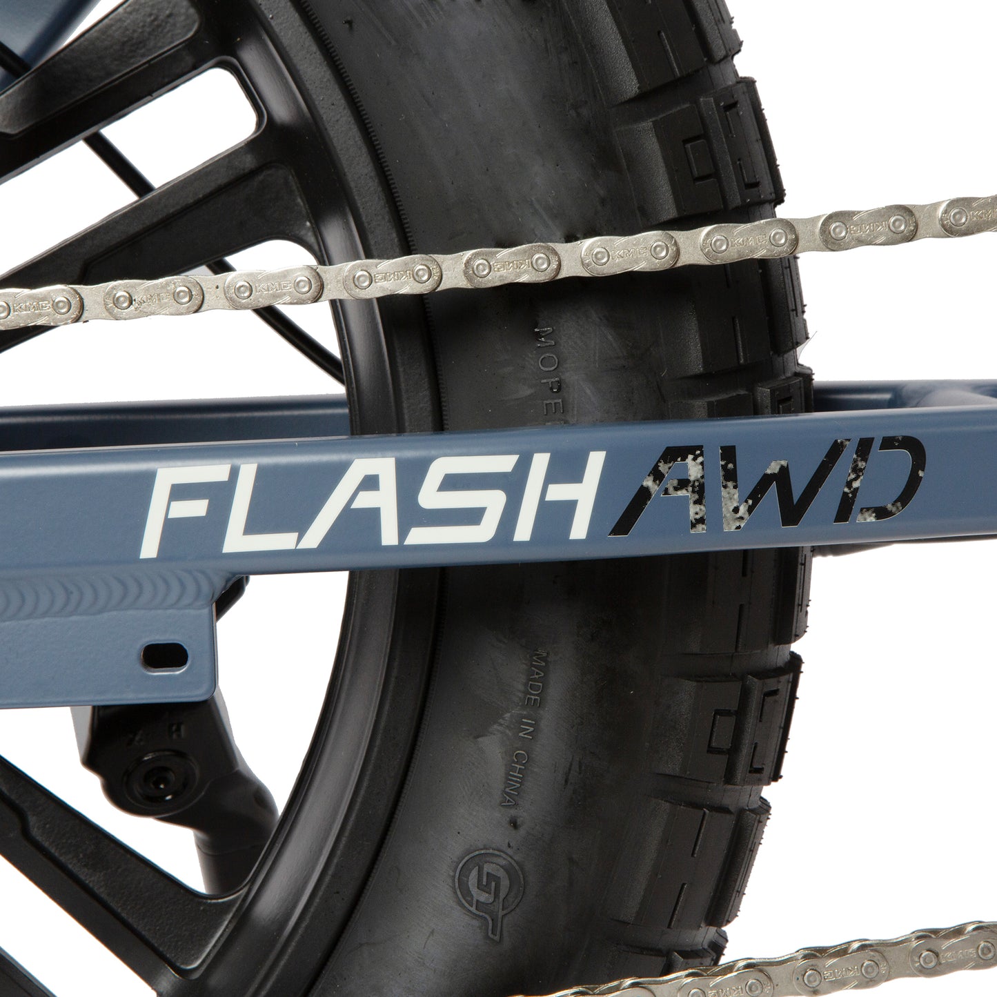 Close-up of a bike chain and 'FLASH AWD' frame on a white background