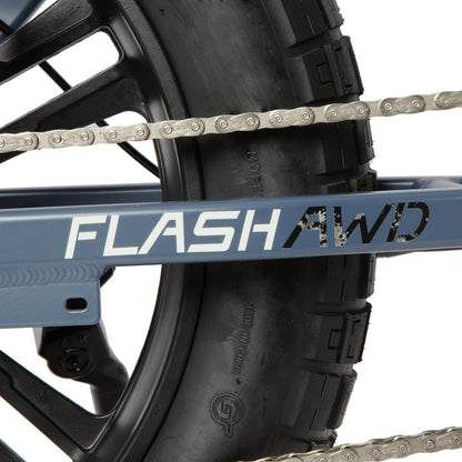 Close-up of a bike chain and 'FLASH AWD' frame on a white background