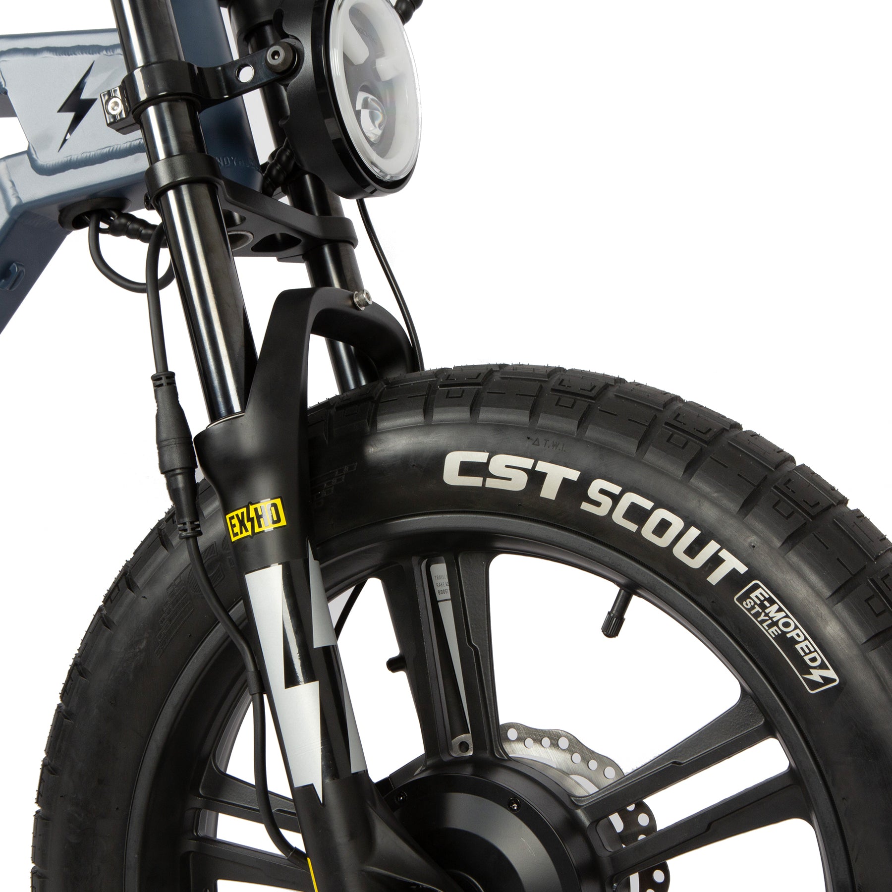 Close-up of a CST Scout tire on a bike with a white background