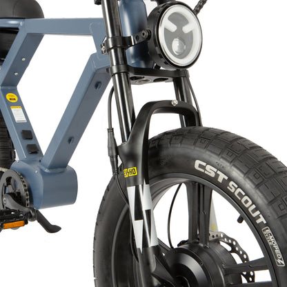 Close-up of a bicycle with CST Scout tire on a white background