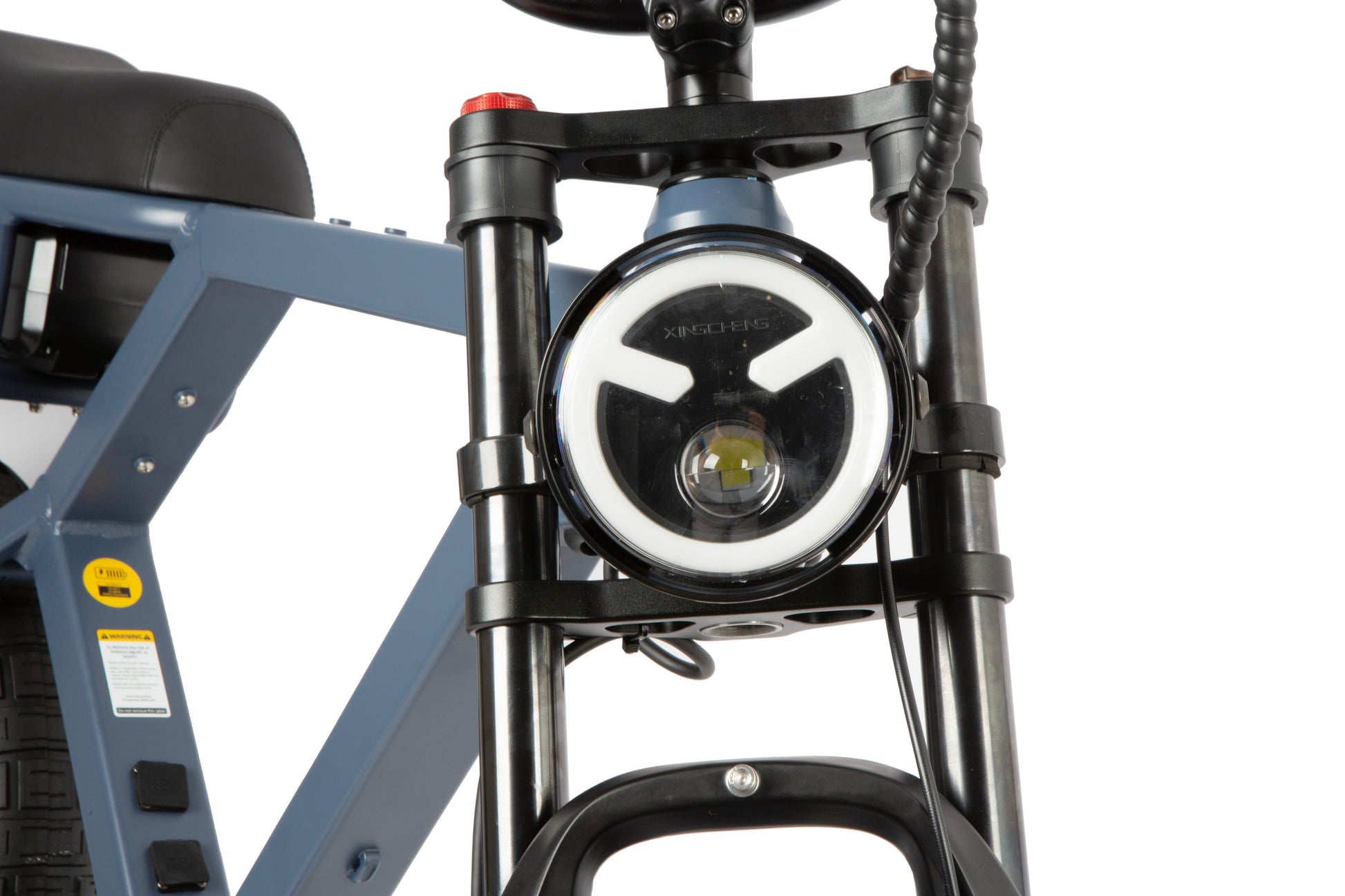 Close-up of a bicycle headlight on a white background