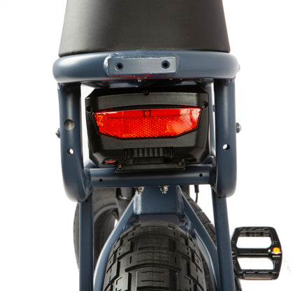 Back view of a bicycle with a red taillight on a white background