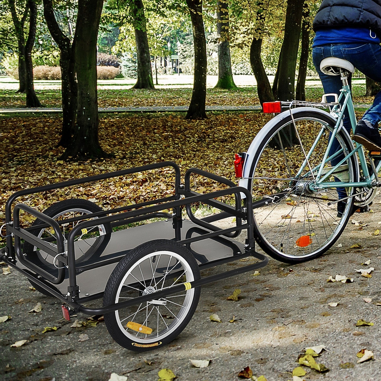 Bicycle with a trailer attached in a park setting